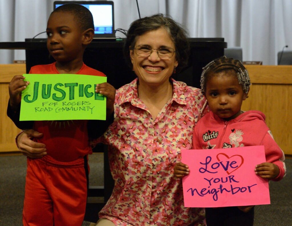 Maria with children advocating for justice