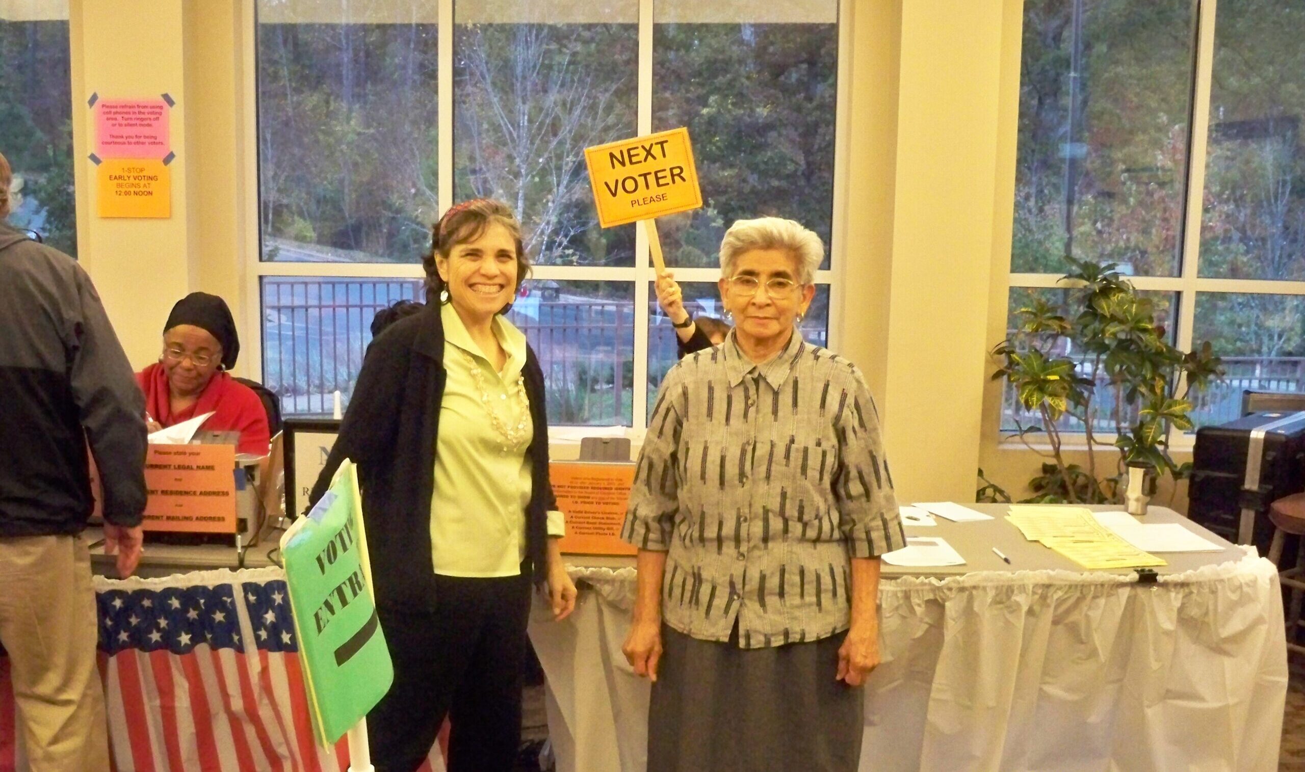 Maria helping a new voter navigate the system