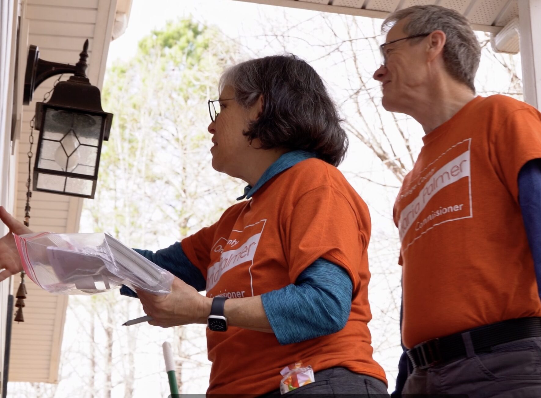 María and Micheal talking with voters